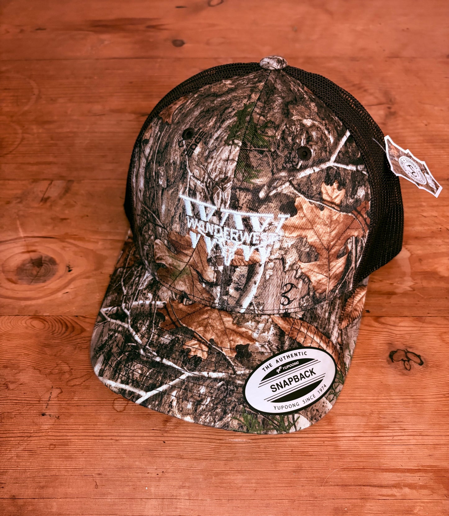 Northwoods Mark Camo is clean, sharp, and built for everyday wear. Designed for people who appreciate gear that works hard without trying too hard, the Northwoods Mark Camo combines classic woodland camo styling with a crisp white WanderWest mark that stands out in all the right ways. It’s bold enough to make a statement, while still staying versatile enough to wear with just about anything in your wardrobe.
The classic woodland camo pattern gives the hat a timeless outdoor-inspired look that feels right a